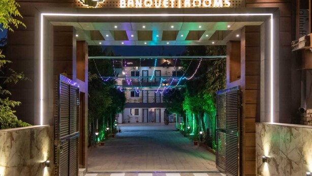 The entrance to Maple Delite Banquetrooms with illuminated signage and decorative lighting. - Hotel Maple Delite (Lucknow)