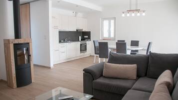 Deluxe appartement | Woonruimte | Flatscreentelevisie