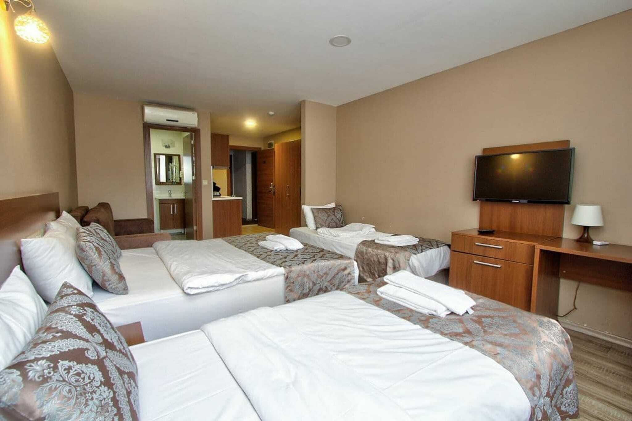 deluxe quadruple room | egyptian cotton sheets, premium bedding, minibar, in-room safe