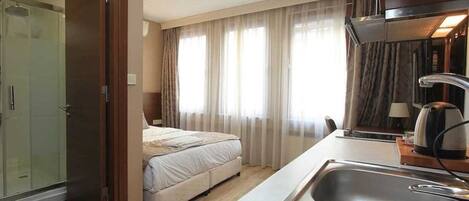 Egyptian cotton sheets, premium bedding, minibar, in-room safe