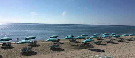 On the beach, sun-loungers