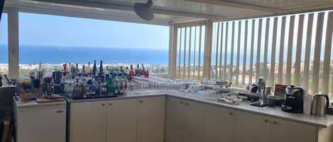 Fridge, coffee/tea maker, electric kettle, cookware/dishes/utensils