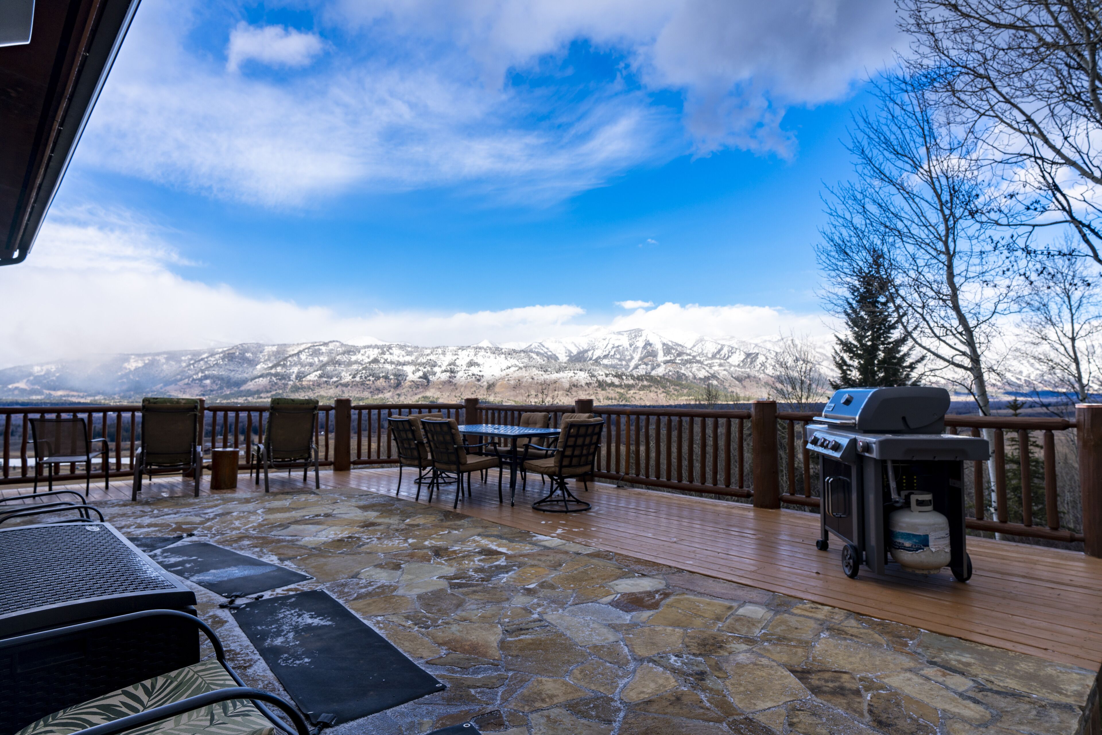 A view of the deck with the heat mats to keep the path clear to the hot tub.
