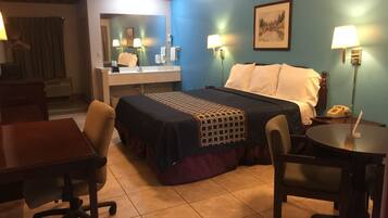 Cozy retreat with a comfortable bed, desk, and seating area.