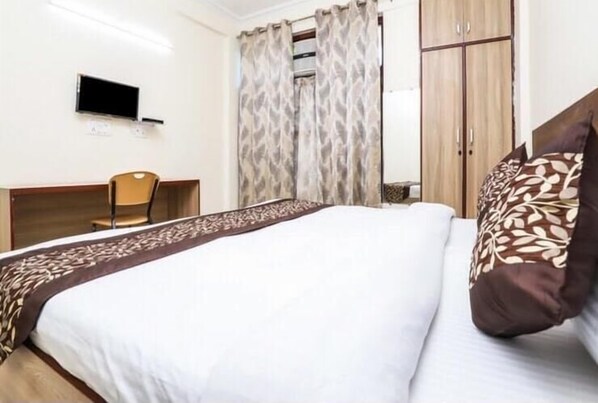 Individually furnished, desk, laptop workspace, rollaway beds