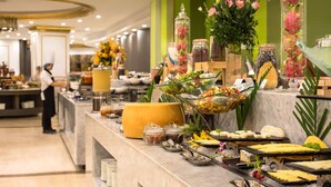A buffet setup with various food items and decorative elements. - Citadines Blue Cove Danang (Da Nang)