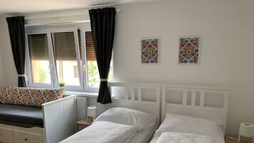 Desk, laptop workspace, blackout drapes, free cribs/infant beds