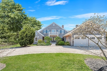 Front of house with circular driveway