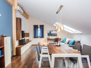 Comfort Apartment, 2 Bedrooms, Terrace (Blue) | Living area | 0-inch LED TV with satellite channels, TV, video game console