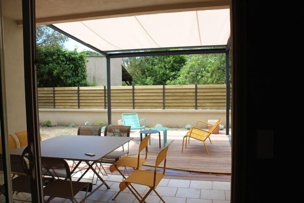 View of the garden and its teak terrace