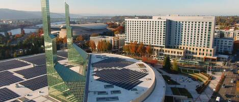 A modern building with a curved roof and solar panels.