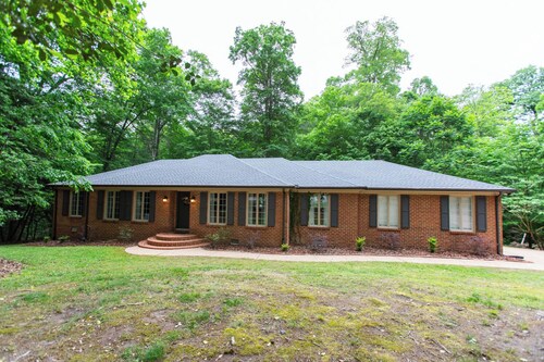 Colonial Brick Home Nestled in the Woods.