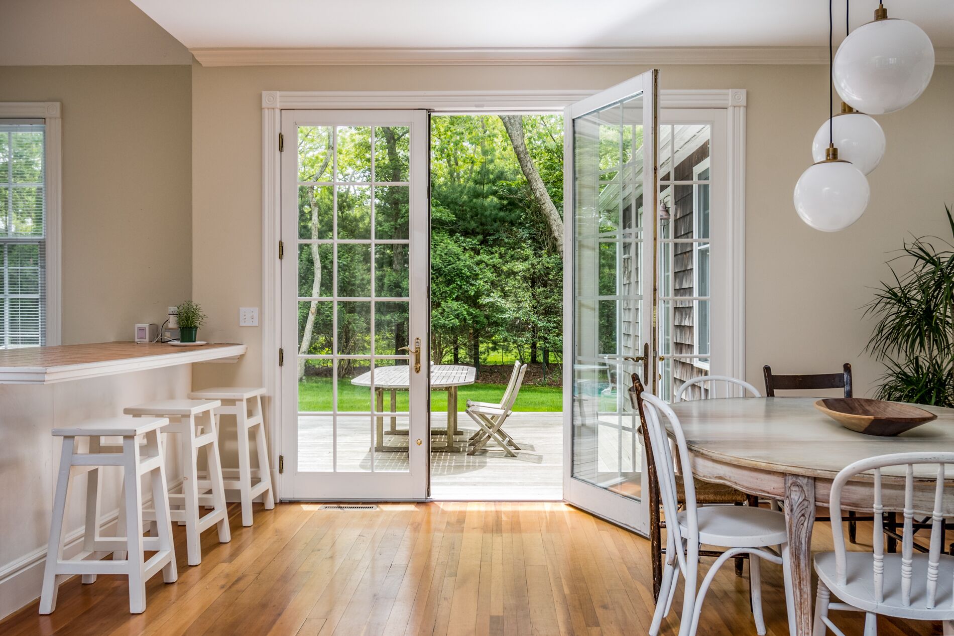 Kitchen island, dining room and access to back porch