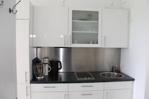Fridge, microwave, stovetop, coffee/tea maker