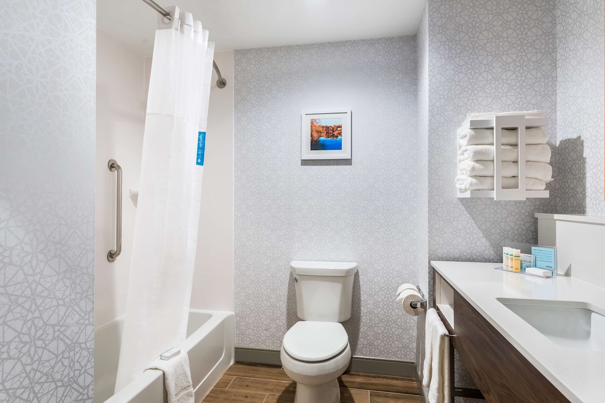 room, 2 queen beds, refrigerator & microwave | bathroom | free toiletries, hair dryer, towels