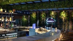 A bar area with a curved counter, seating, and a sign for 'Cloud22 Rooftop Bar'. - Doubletree By Hilton Surabaya (Surabaya)