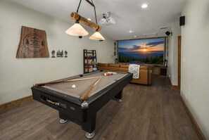 A pool table with a wooden ceiling and a sunset mural in the background. - 4BR Home with Game Room, Pool Table & Fire Pit (Blowing Rock)