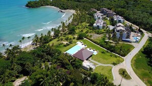 An aerial view of a resort with multiple buildings, a large swimming pool, and a beach area. - Stunning Luxury Oceanfront House, Modern,  Best of The Best Location  (Las Terrenas)