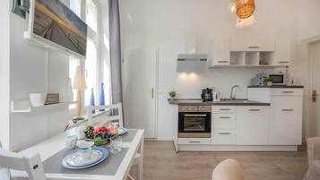 Fridge, microwave, stovetop, coffee/tea maker