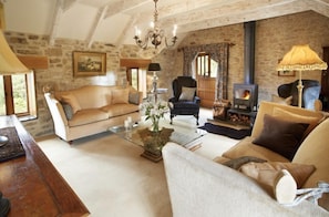 First floor:  Elegant sitting room with wood burning stove - Tregadjack Barn, Tregathenan, Near Porthlevan , Cornwall (Helston)