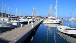 A marina with multiple boats docked at wooden piers. - Uribellinu 2, nice T3 mountain sea view (santa maria di lota)