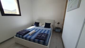 2 dormitorios, tabla de planchar con plancha, wifi gratis y ropa de cama