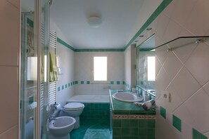 Bathtub, hair dryer, bidet