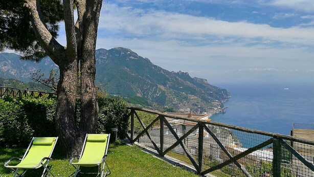 A coastal view with a tree and two green lounge chairs. - My Rental Homes - Il Giardino di Ravello with ample private garden and sea view (Ravello)