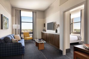 Suite, 1 King Bed (Main Line) | Living area | 50-inch LCD TV with digital channels, TV, music library - The Central Station Memphis, Curio Collection by Hilton (Memphis)