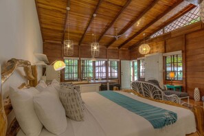 Suite, Multiple Beds, Garden View | Minibar, in-room safe, free WiFi, bed sheets