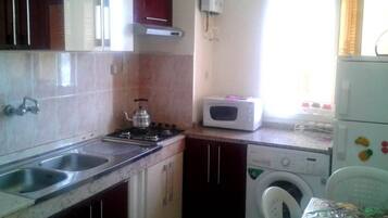 Fridge, microwave, stovetop, cookware/dishes/utensils