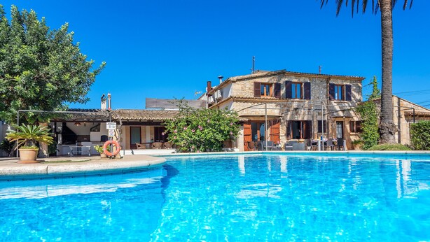A swimming pool with a stone building in the background. - LES MURTERETES   ref. VP79 (Pollensa / Pollença)