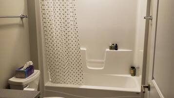 Combined shower/bathtub, towels, soap, shampoo