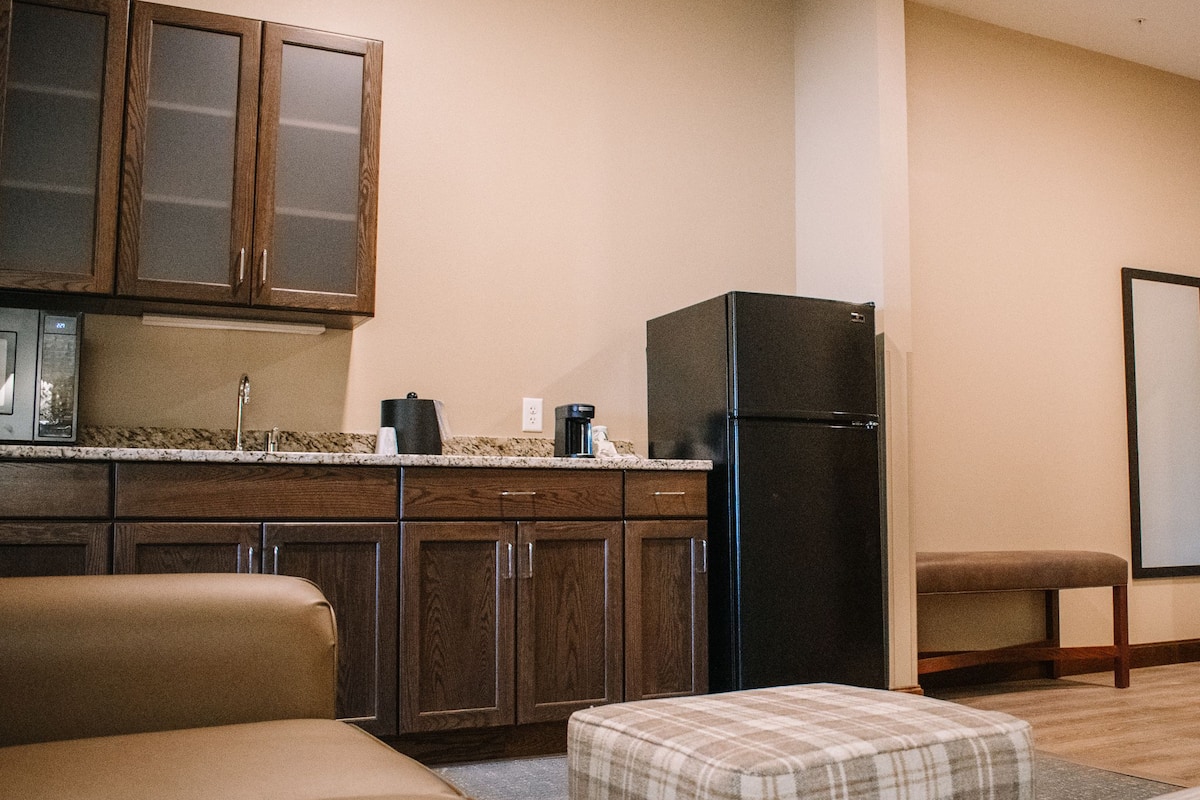 king suite with kitchenette | living area | flat-screen tv