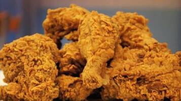 A pile of fried chicken pieces.