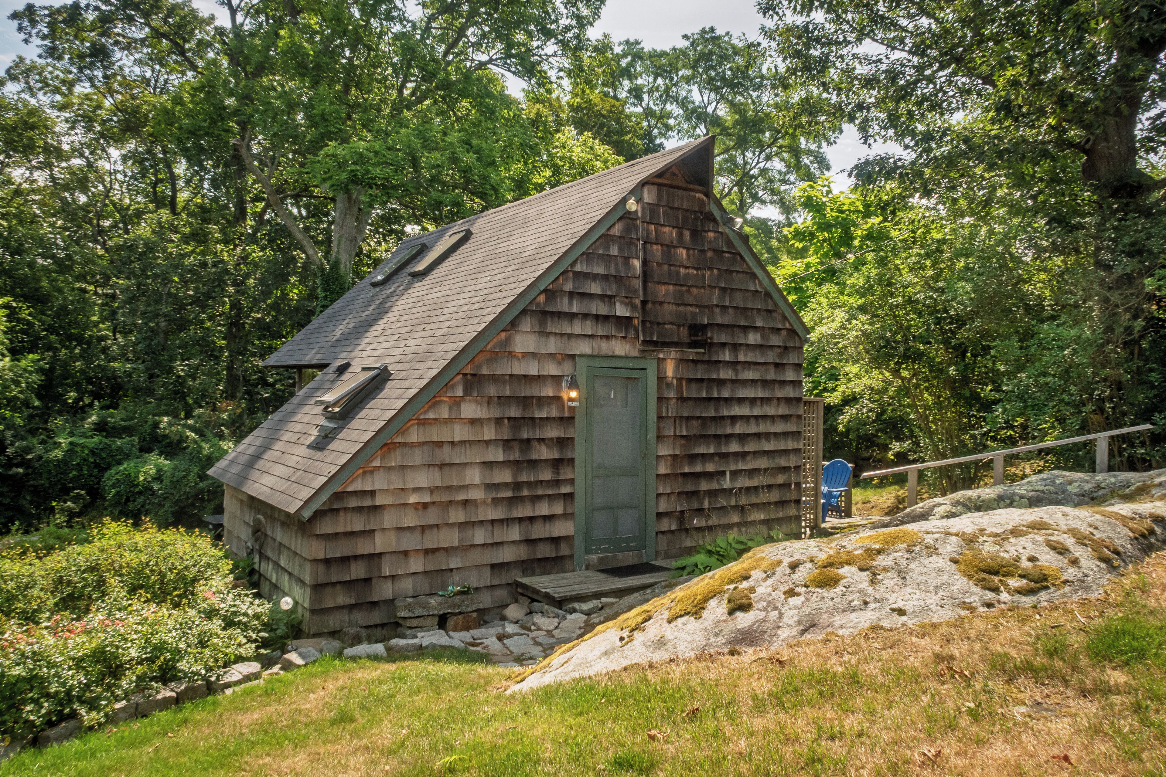View of Cottage front, main door, 3 skylights.