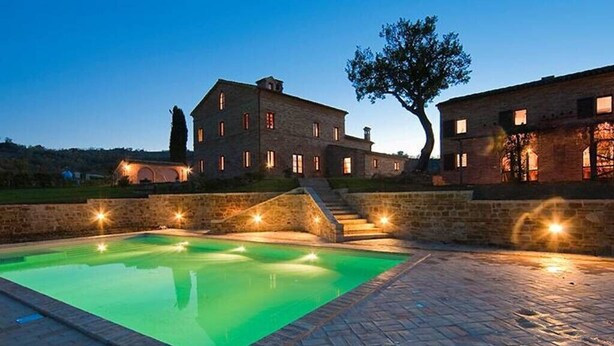 A large stone building with a swimming pool, surrounded by a paved area and a tree. - Villa Serena - Homelike Villas (Sant'Angelo in Pontano)