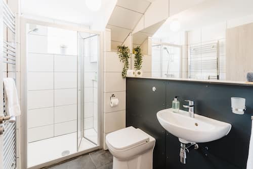 Junior Suite, Non Smoking, Private Bathroom | Bathroom | Shower, designer toiletries, hair dryer, heated floors
