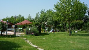 A park with a playground, a gazebo, and a walking path. - Apartment in farmhouse, Venice. Bedroom, bathroom, full kitchen / living room. (Oriago)