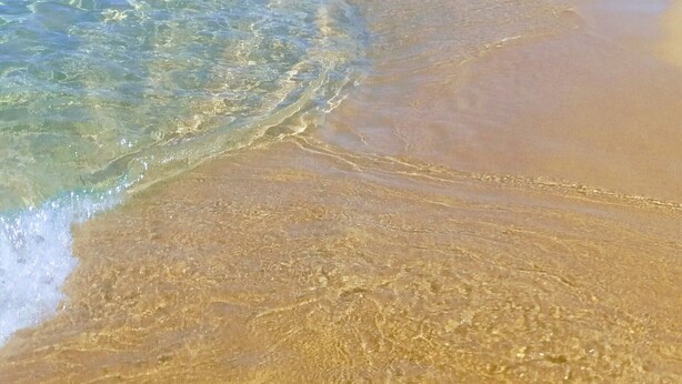 A beach with clear water, sandy shore, and distant mountains. - House 2 rooms +Garden, barbecue, children max 11 years free, in Costa Verde.  (Fluminimaggiore)