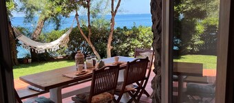 House by the sea with equipped terraces, direct access to the sea