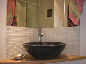 Shower, hair dryer, towels, toilet paper