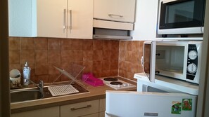 Microwave, coffee/tea maker, cookware/dishes/utensils