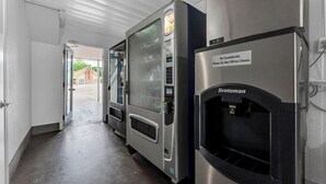 A hallway with vending machines and a water dispenser. - Motel 6 Branson, MO (Branson)