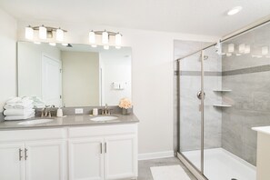 Combined shower/tub, hair dryer, towels, soap