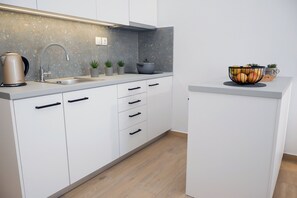 Fridge, coffee/tea maker, cookware/dishes/utensils
