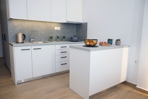 Fridge, coffee/tea maker, cookware/dishes/utensils