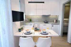 Fridge, coffee/tea maker, cookware/dishes/utensils