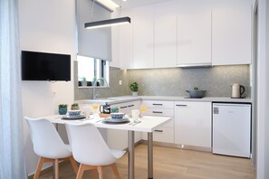 Fridge, coffee/tea maker, cookware/dishes/utensils