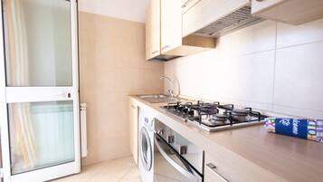 Fridge, stovetop, coffee/tea maker, cookware/dishes/utensils